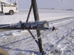 downed pole covered in ice
